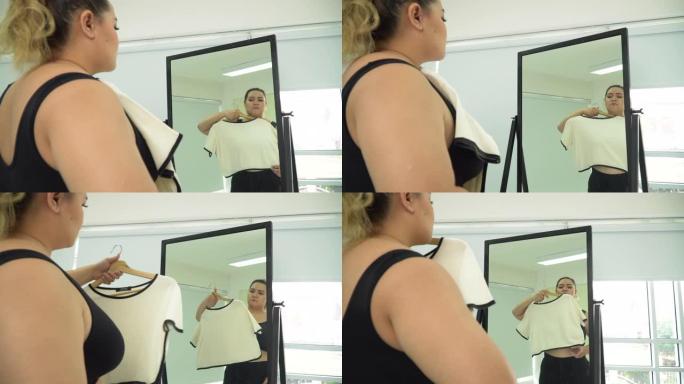 有体重问题的女人看着镜子里的身体
