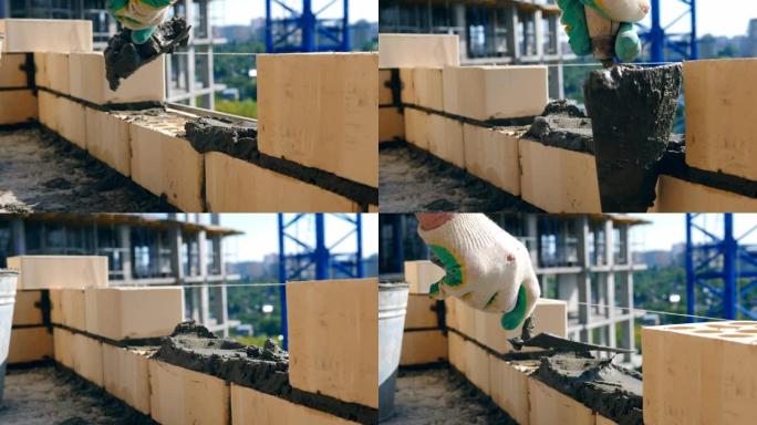 建筑工地砌砖的过程。