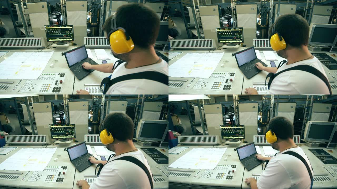 男性检查员正在使用计算机设备