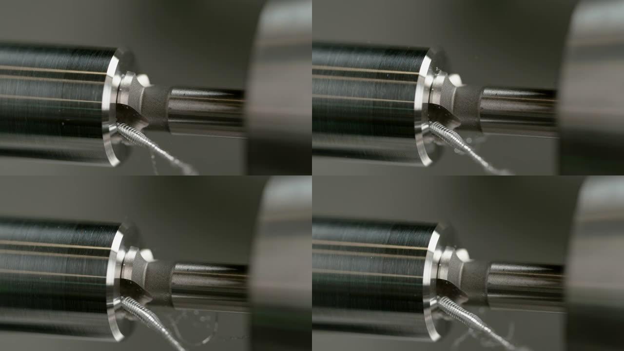 宏观，dow: 锋利的钻头在闪亮的铝棒中间钻一个孔。