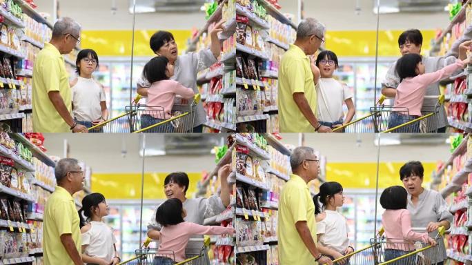 亚洲华人多代家庭祖父母和孙子在杂货店购买商品和日用品