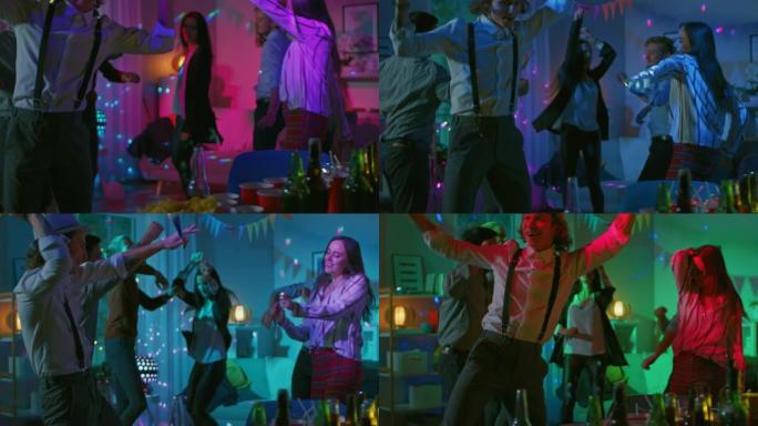 在大学之家的服装聚会上: 各种各样的朋友玩得开心，跳舞，社交和喝酒。时尚的男孩和女孩在客厅跳舞。迪斯