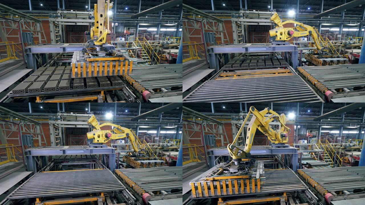 工业工厂的产品正在被自动机器人机械手搬迁。