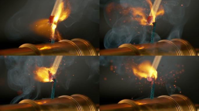 宏观: 燃烧的火柴点亮了微型黄铜大炮的蓝色短保险丝。