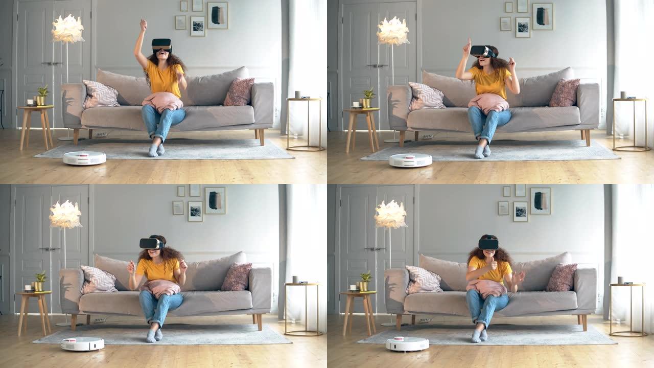 一位戴着VR眼镜的女士和地板上的机器人胡佛。机器人，类人机器人概念。