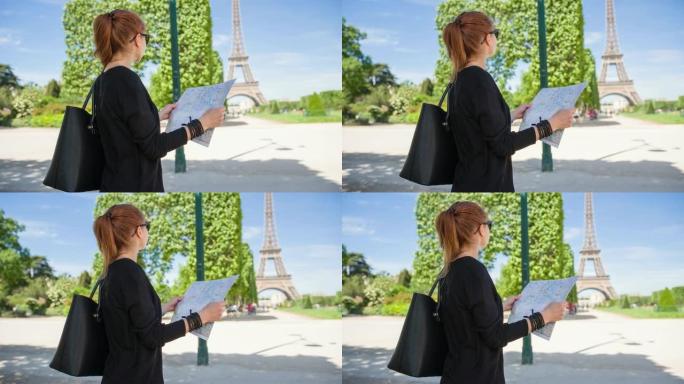 巴黎城市地图上的年轻女性游客看着埃菲尔铁塔