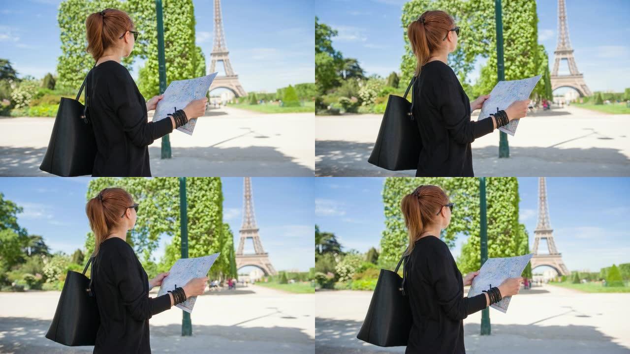 巴黎城市地图上的年轻女性游客看着埃菲尔铁塔