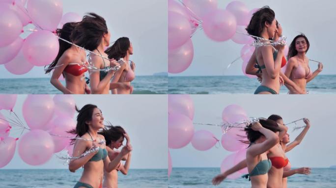 一群女朋友带着气球在蓝天的背景下在海滩上奔跑。幸福的朋友在夏日阳光明媚的阳光下在海滩上玩耍。假期。