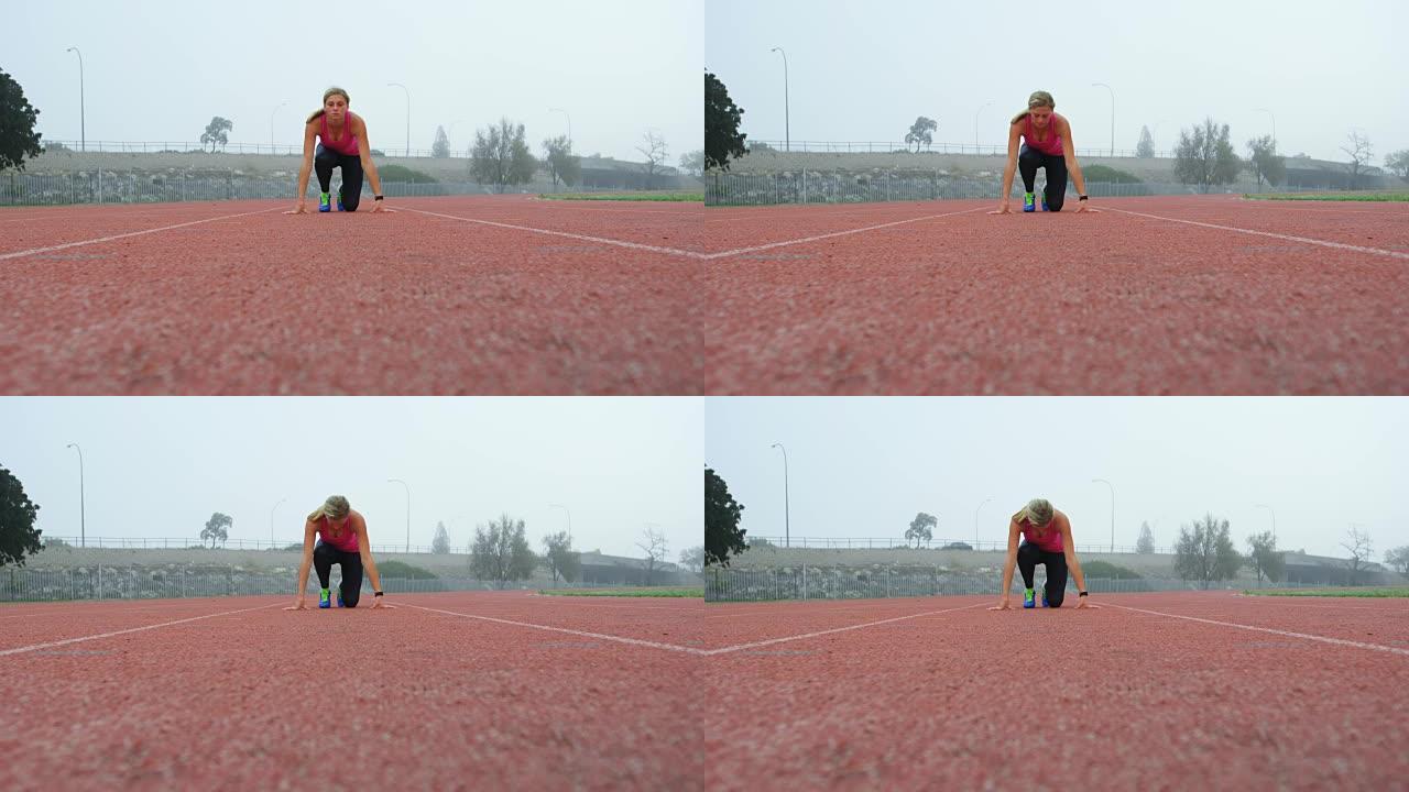 女运动员在4k跑道上处于起始位置