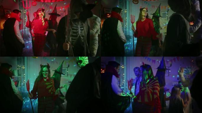万圣节服装派对: 一群怪物在装饰有迪斯科球灯的房间里跳舞。脑死亡僵尸，吸血鬼德古拉，木乃伊，美丽女巫