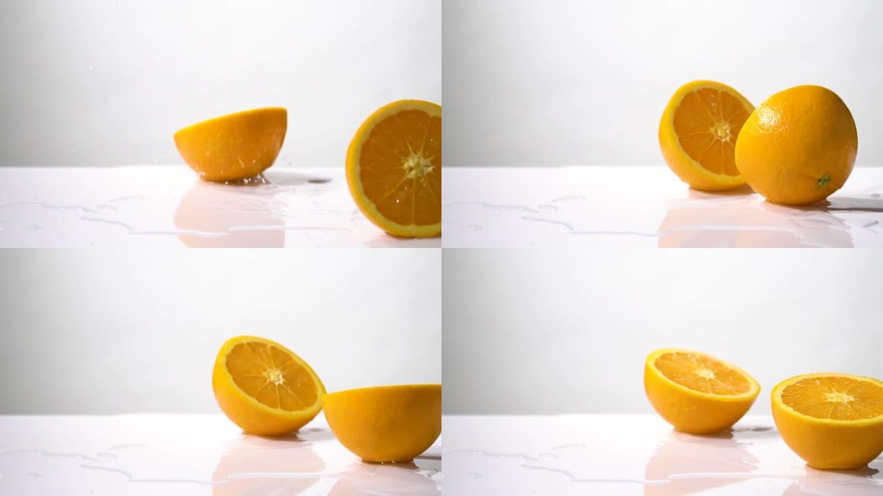 橙色切片下降和飞溅的慢动作