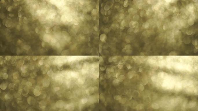 聚焦和旋转技术的4k金色闪光元素。