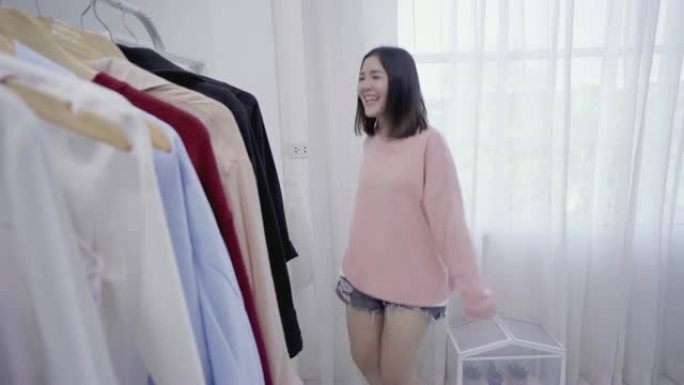 4k分辨率快乐亚洲女人在更衣室跳舞