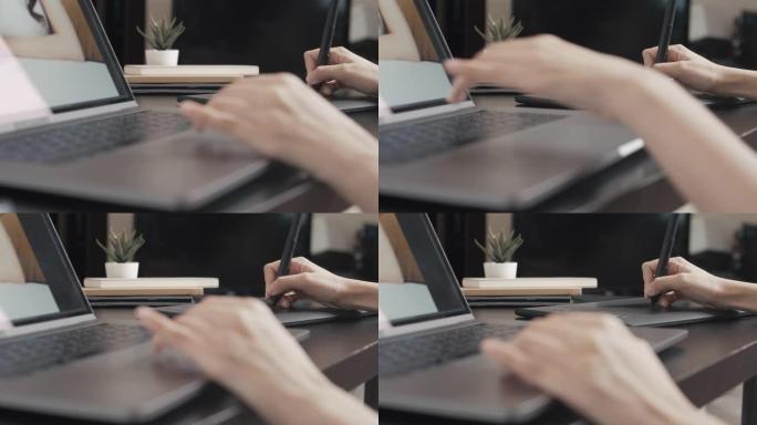平面设计师在带有图形平板电脑的笔记本电脑上工作。摄影师，合成