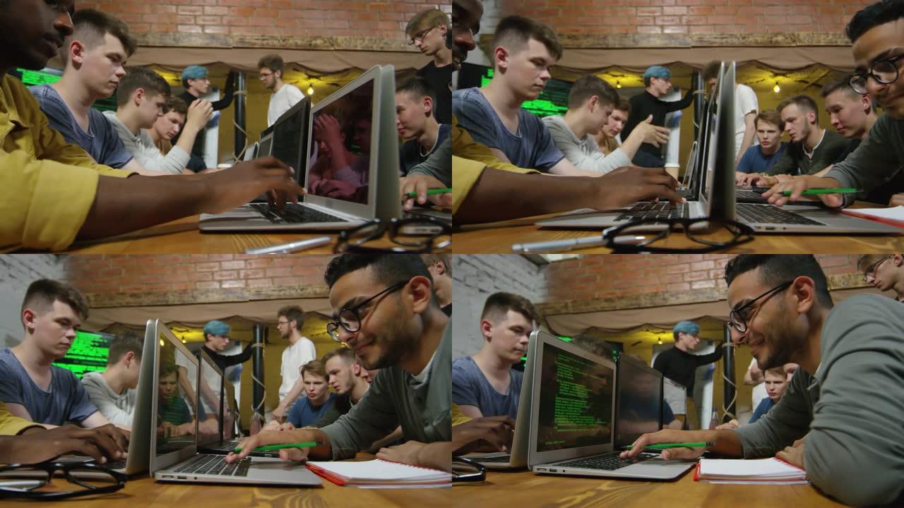 多种族男子在电脑上打字