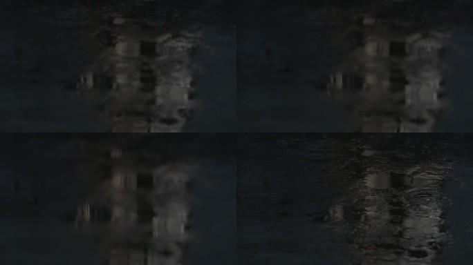 特写幸福古村夜间泛光的水洼