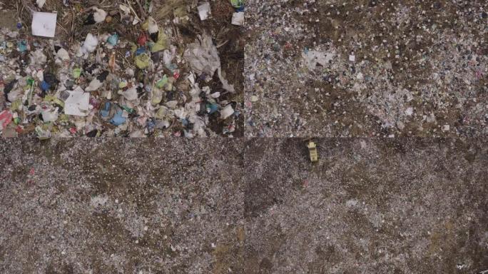 4k直下空中缩小欧洲白鹳在垃圾填埋场清理食物的视野，而推土机，卡车和人们在其中工作