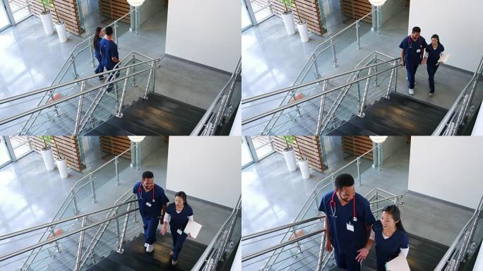 男医生和女护士在医院里走上楼梯