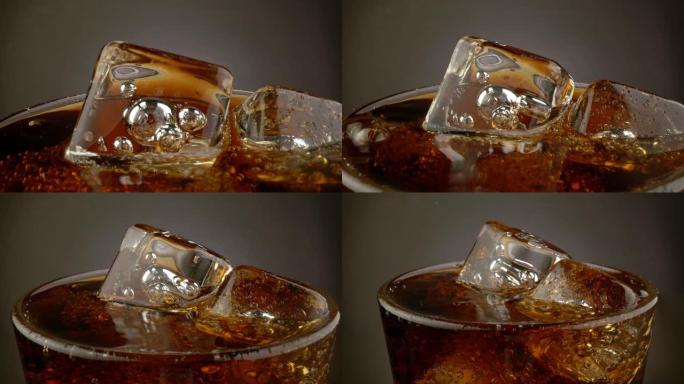 旋转玻璃杯配可乐碳酸饮料和冰块。黑暗背景。4K