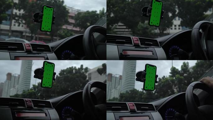 在汽车上使用智能手机的商人特写镜头，绿屏
