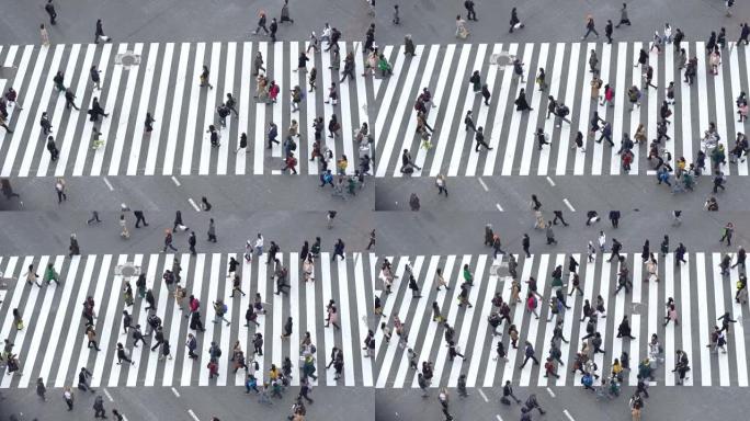 在高峰时间，人群拥挤的人群穿过街道