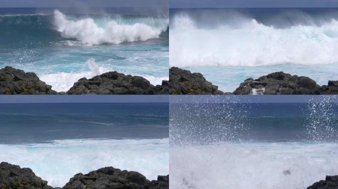 慢动作: 接近火山岛的波浪坠入多岩石的海岸。