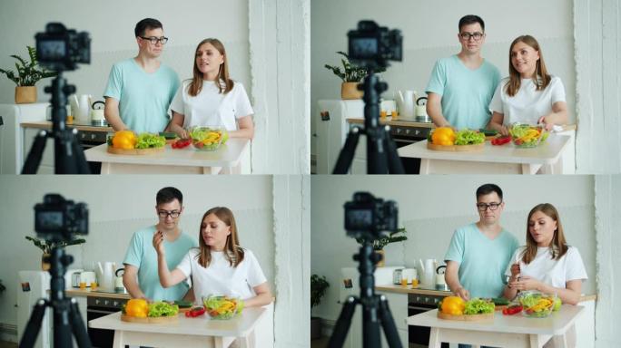 男人和女人在厨房录制vlog视频，使用相机显示蔬菜