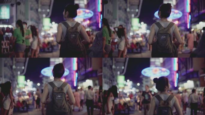 慢动作亚洲美女走在泰国曼谷考山路的夜市街