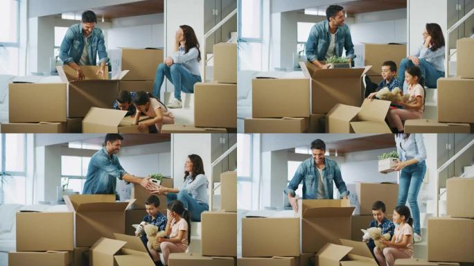 幸福家庭的慢动作买了新房子，并打开了搬进来的包装盒。
