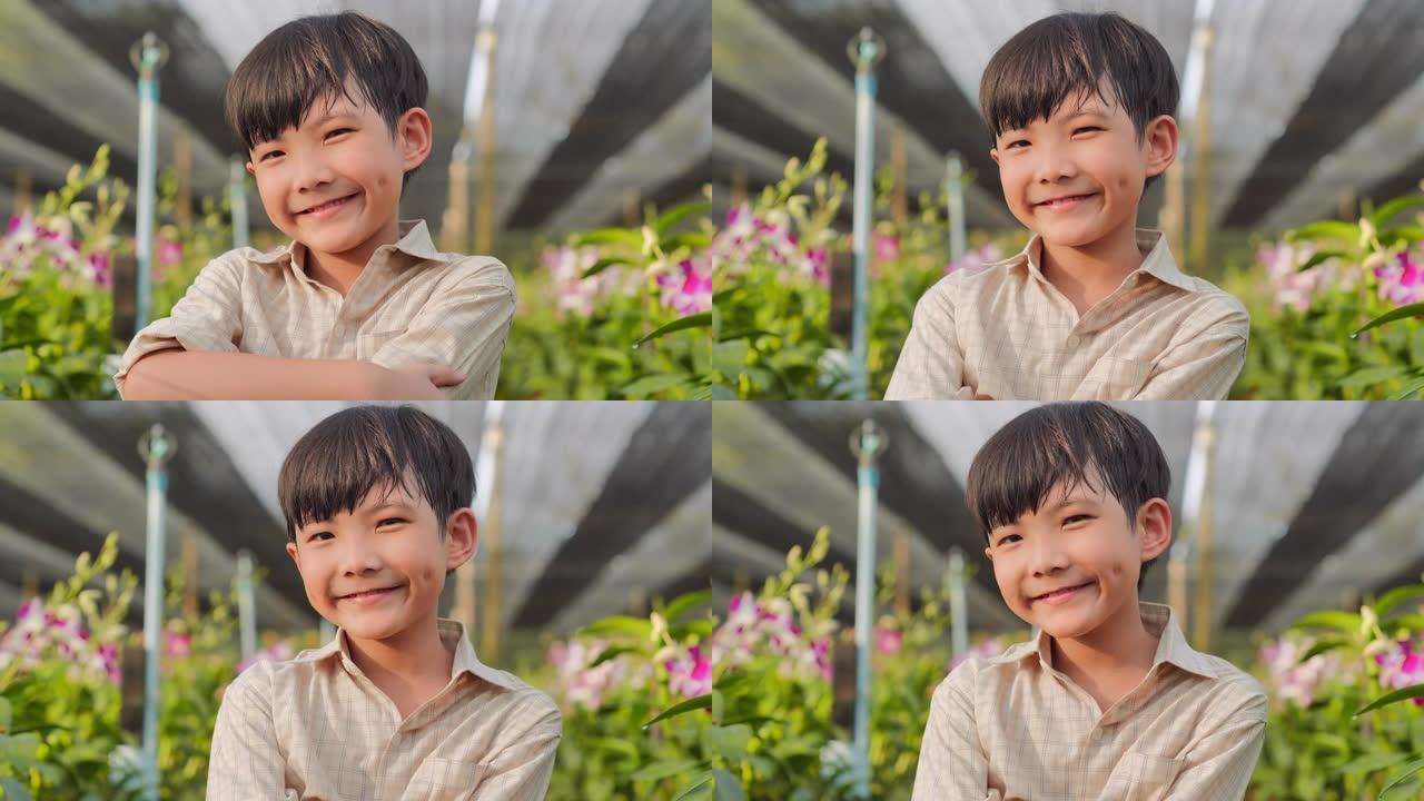 肖像男孩在美丽的春天微笑。在花园里户外的男婴。农业，园艺，农业，收获和人，教育，有机农业，植物护理和