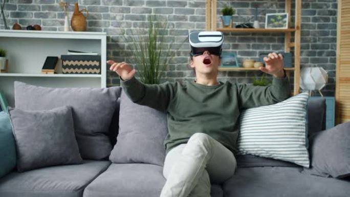 激动的人的慢动作享受虚拟现实眼镜的新体验