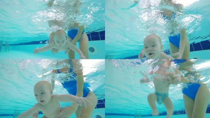 一个婴儿在游泳池的水下潜水。水下射击。
