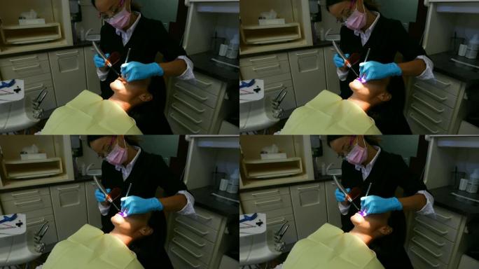 女牙医用工具检查病人4k