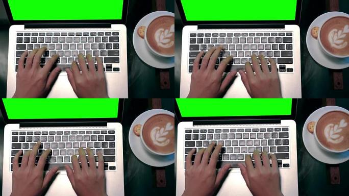 4k镜头场景顶视图特写镜头亚洲女商人在咖啡咖啡馆、商业和生活方式概念中使用绿屏笔记本电脑和咖啡拿铁艺