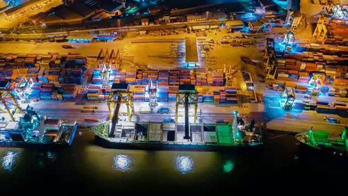 鸟瞰图无人机-东南亚夜间工业港口或船坞与集装箱船的延时或延时
