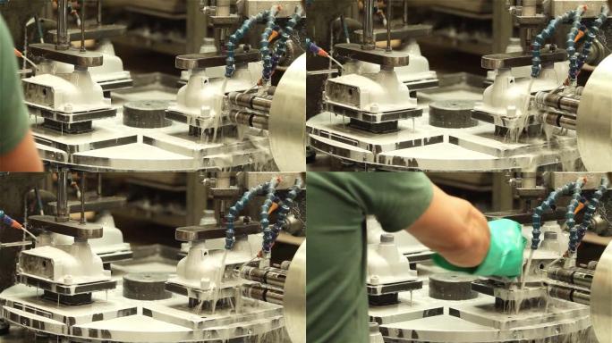 工厂用水射流加工金属件的数控机床。