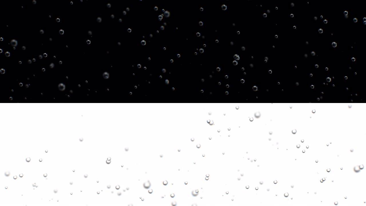 美丽的气泡水在玻璃慢动作。气泡从底部上升在慢动作的3d动画。清爽的碳酸苏打饮料近距离模糊。