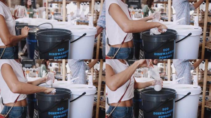 免费塑料杂货店用洗碗机粉末填充容器的女人
