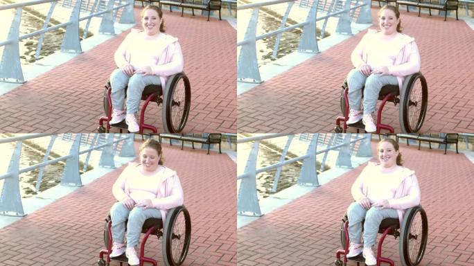 坐在轮椅上的脊柱裂年轻女子