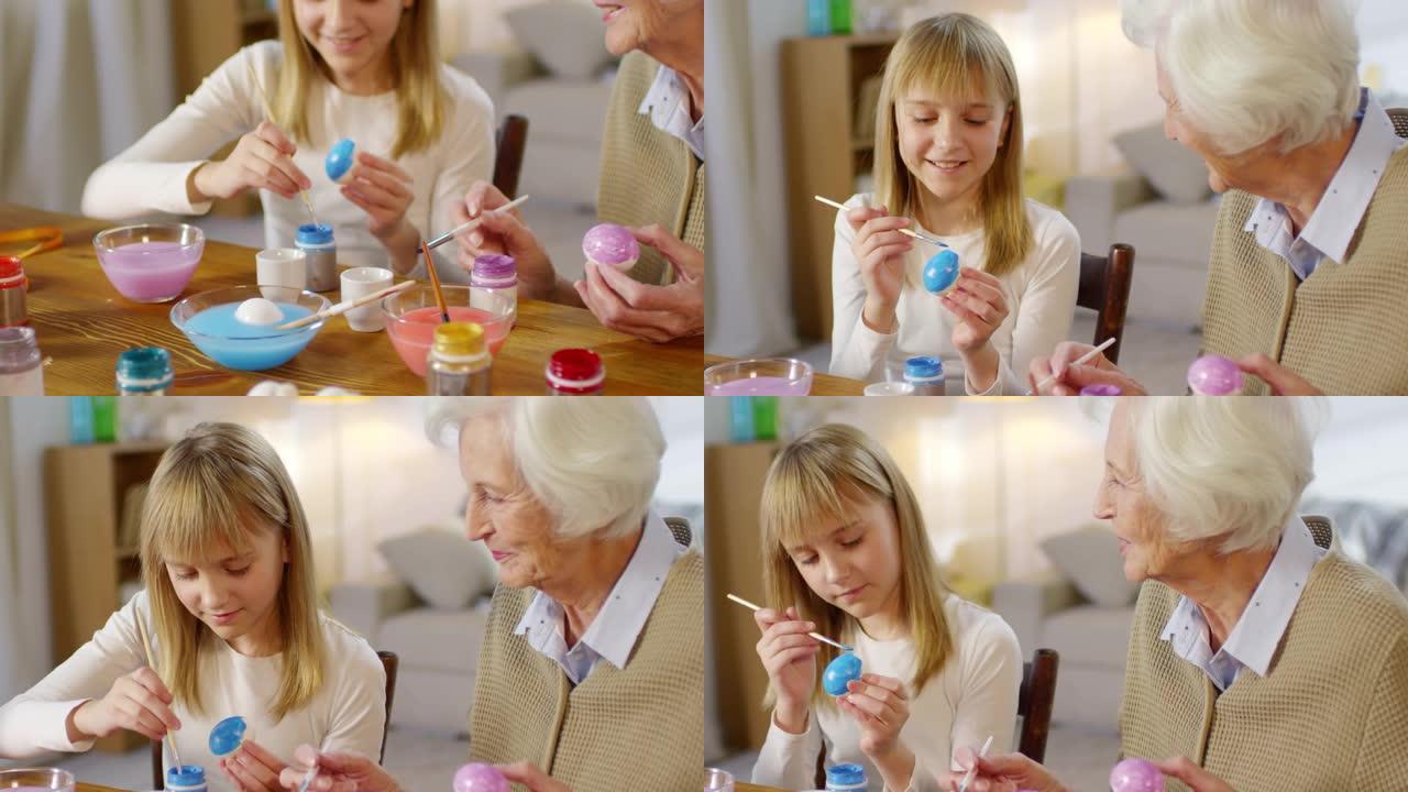 祖母和孙女用水粉画鸡蛋