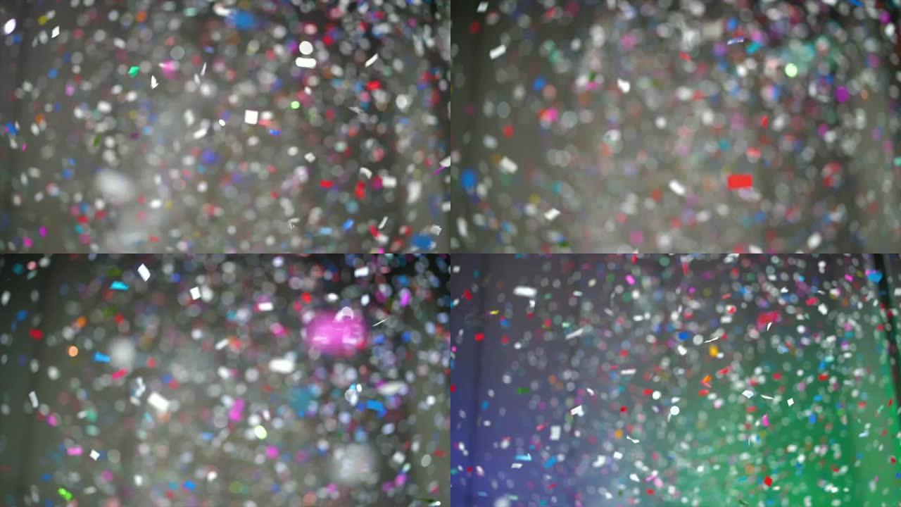 4k慢动作镜头，彩色五彩纸屑从房间上方掉落，以新年快乐和派对概念庆祝