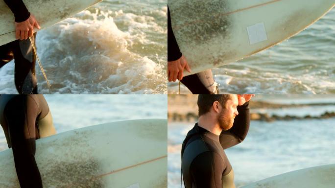 中年白人男性冲浪者的侧视图，遮光眼睛在4k海滩看大海