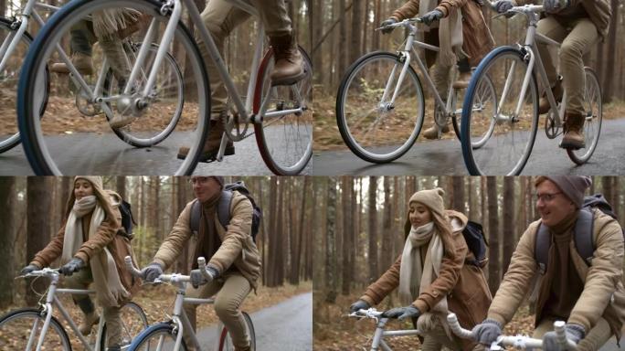 年轻的高加索男人和女人在秋天骑自行车