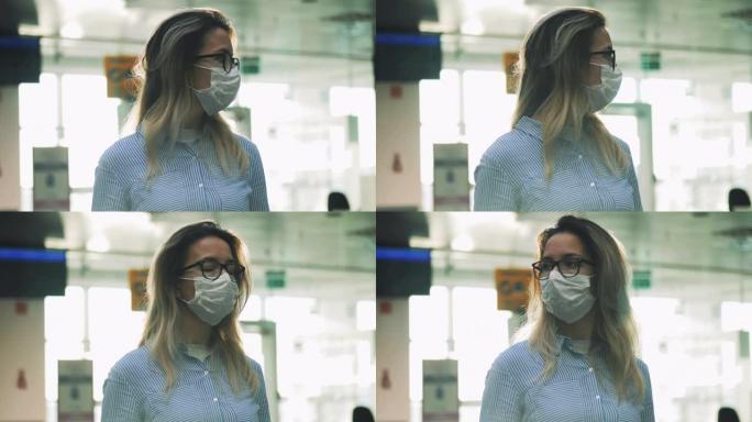 戴着医用口罩和眼镜的妇女通过玻璃拍摄。冠状病毒、流行病、感染概念。