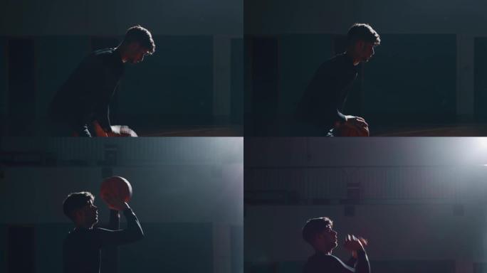 一名年轻的非洲职业男球员的电影慢动作镜头正在健身房进行篮球锻炼时扣篮