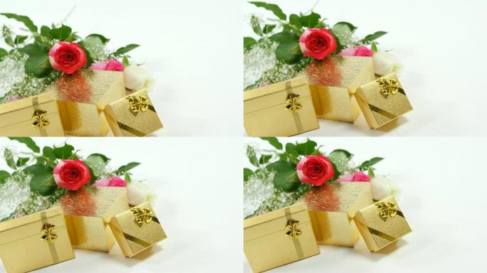 金色礼品盒和玫瑰花花束4k