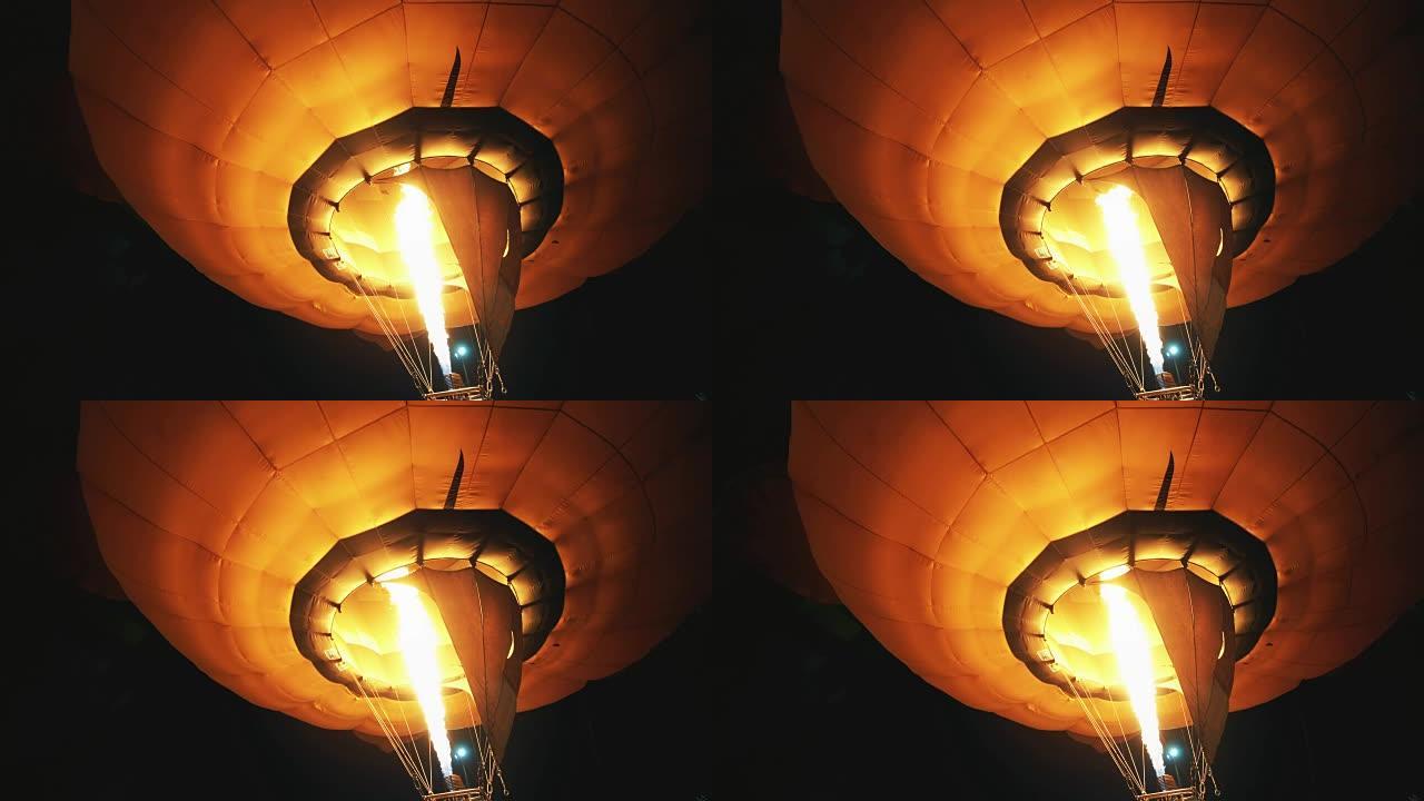 晚上热气球。晚上给热气球烧火注入动力
