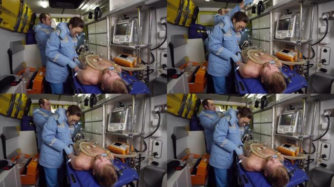 护理人员将IV针插入救护车中的患者手臂