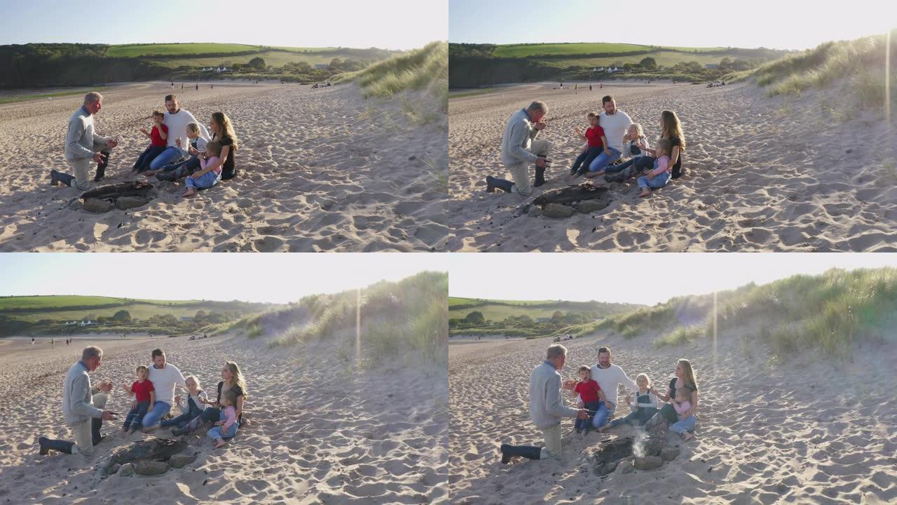 多代家庭在海滩度假时在火上烧烤的无人驾驶飞机拍摄