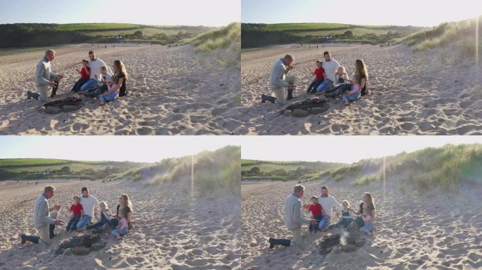 多代家庭在海滩度假时在火上烧烤的无人驾驶飞机拍摄